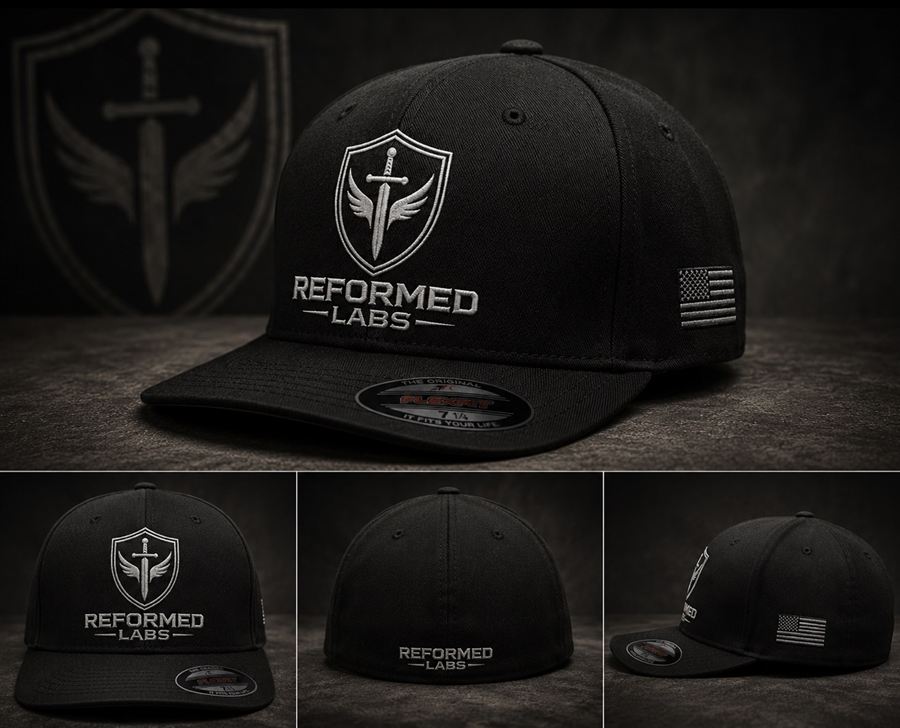 Shield FlexFit hat — black fitted cap with embroidered shield logo and American flag on the side